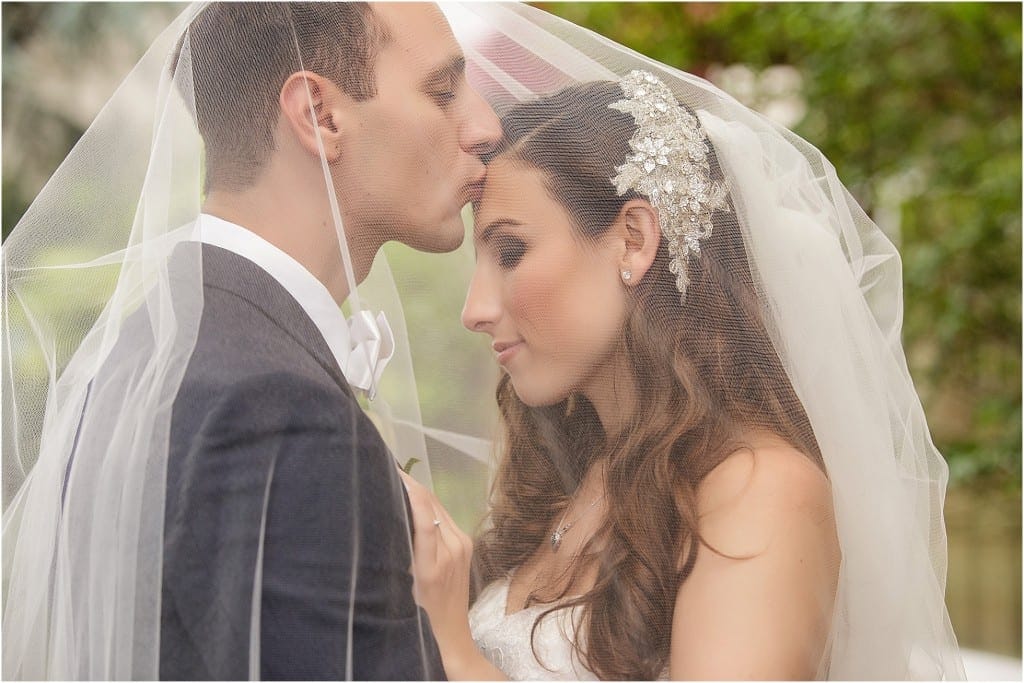 We've said it before and we'll say it again, we absolutely love the dream element that shooting through a veil can bring to couple's portraits.