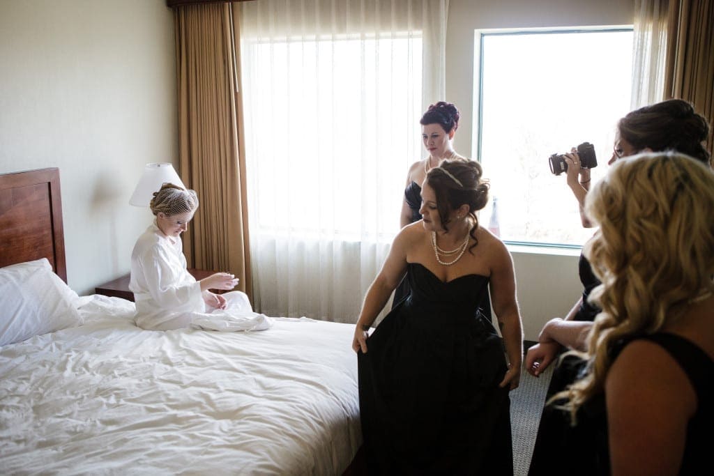 We always do our best to avoid having videographers and our second shooters in your photographs, but sometimes when there is a lot of people in a small room, it's unavoidable. 
