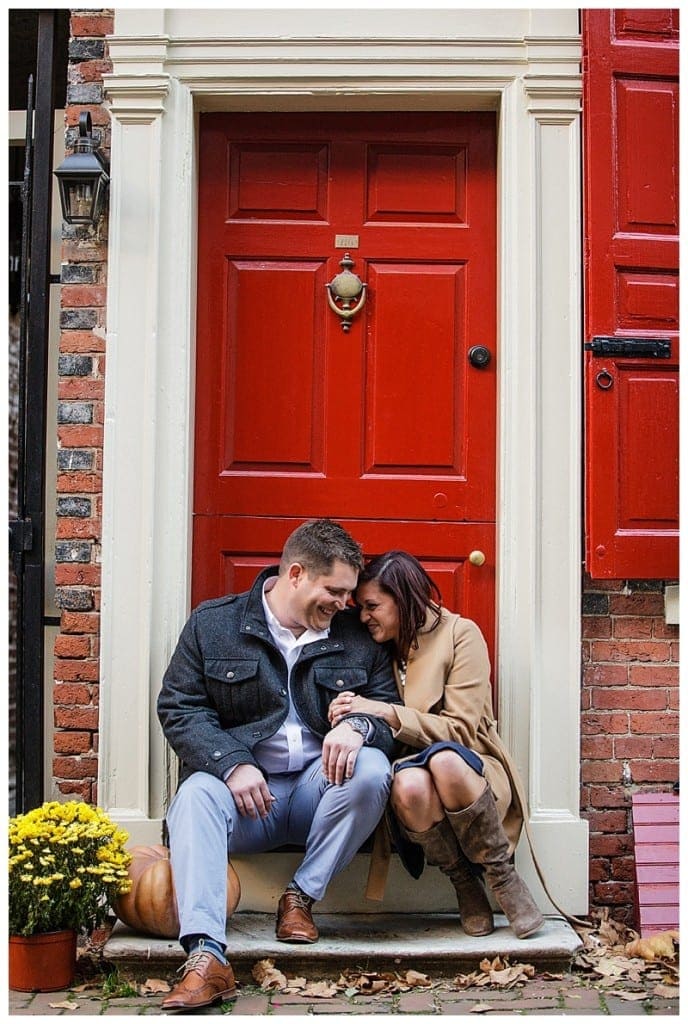 Nothing says cozy fall like boots, warm jackets, and snuggling in front of a bright red door.