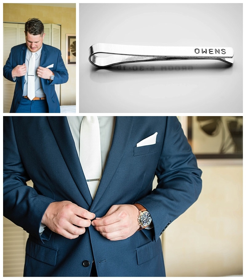 Dan getting ready in his navy blue suit and shiny new tie clip. 