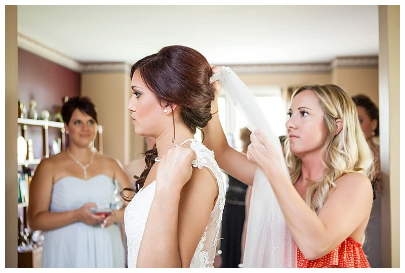 Placement of the veil is a task that requires a steady hand and a few good bobby pins.