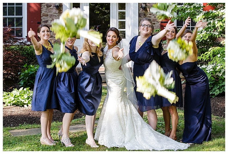 To vary your bridal party portraits, try having the bridesmaids throw their bouquets at the camera instead of the normal jumping photo.