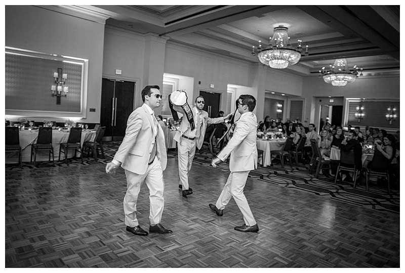 Three of the 14 groomsmen being announced into the reception.