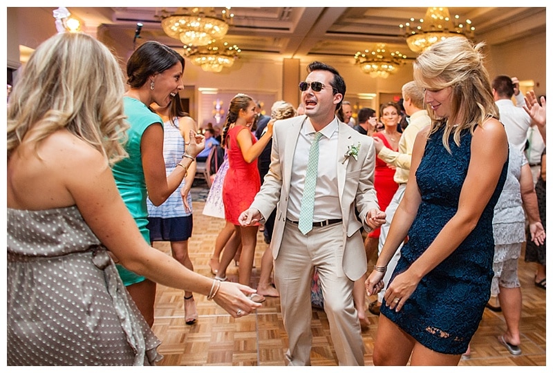 One of the groomsmen tearing up the dance floor.