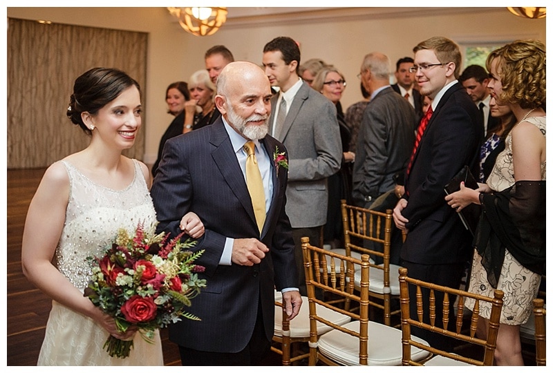 Sabrina and her father about to walk down the aisle. 