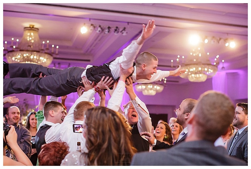A crowdsurfing groom is an awesome groom.