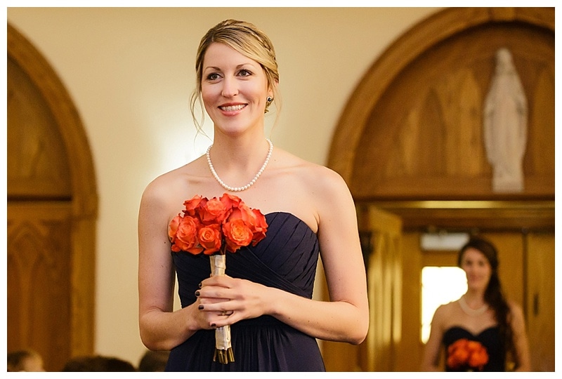Navy blue with coral roses was the color scheme for the bridesmaids and it was simply lovely. 