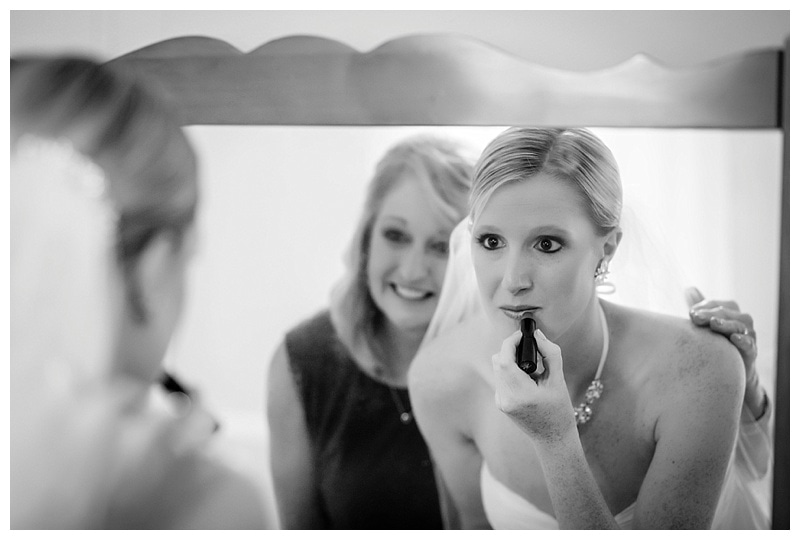 Final touches were applied as one of her bridesmaids grinned excitedly.