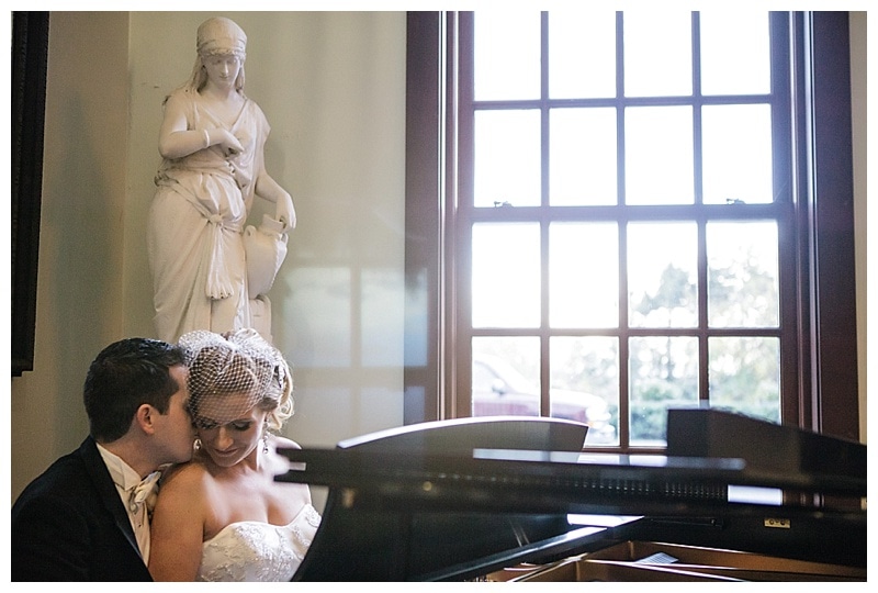Inside the main building was a beautiful piano and we just had to put these two behind it. 