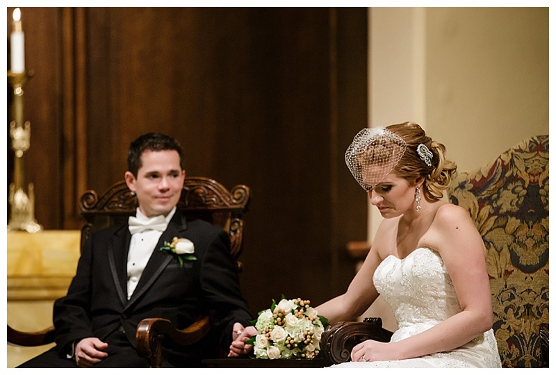 Matt stealing a glance towards his bride as they listen to the priest's homily.