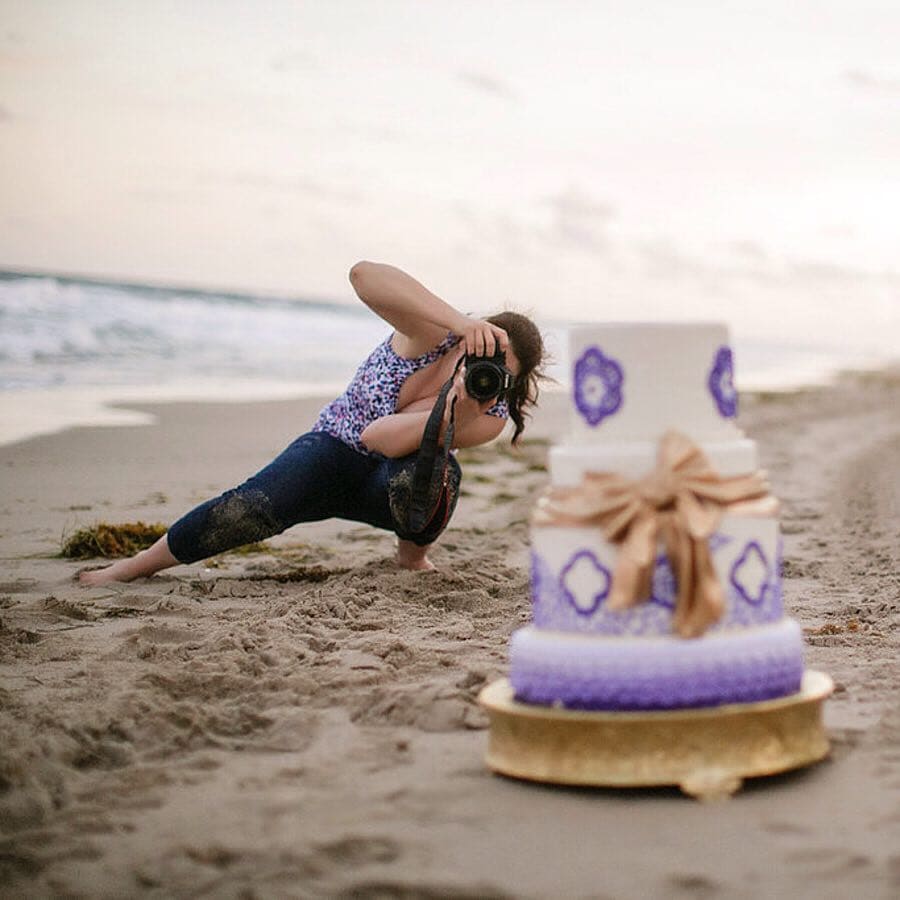 Philadelphia Wedding Photographer Ashley Gerrity gets in the sand at a destination wedding in Palm Beach Florida.