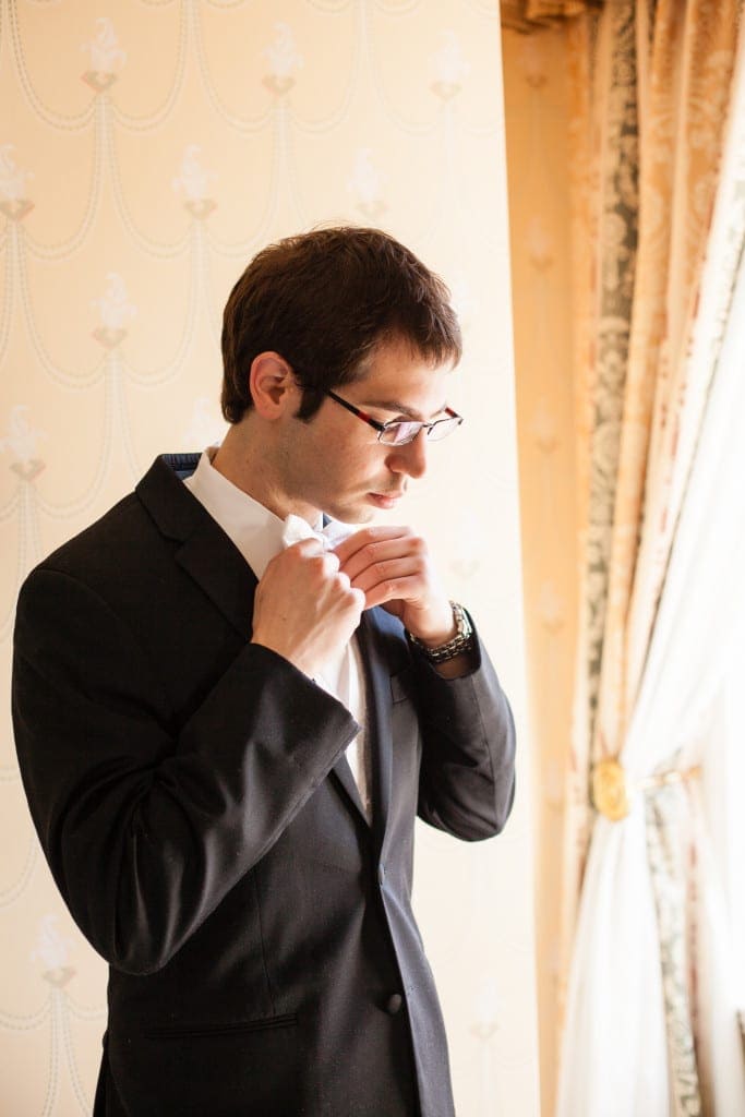 Jared making sure his bowtie is straight.