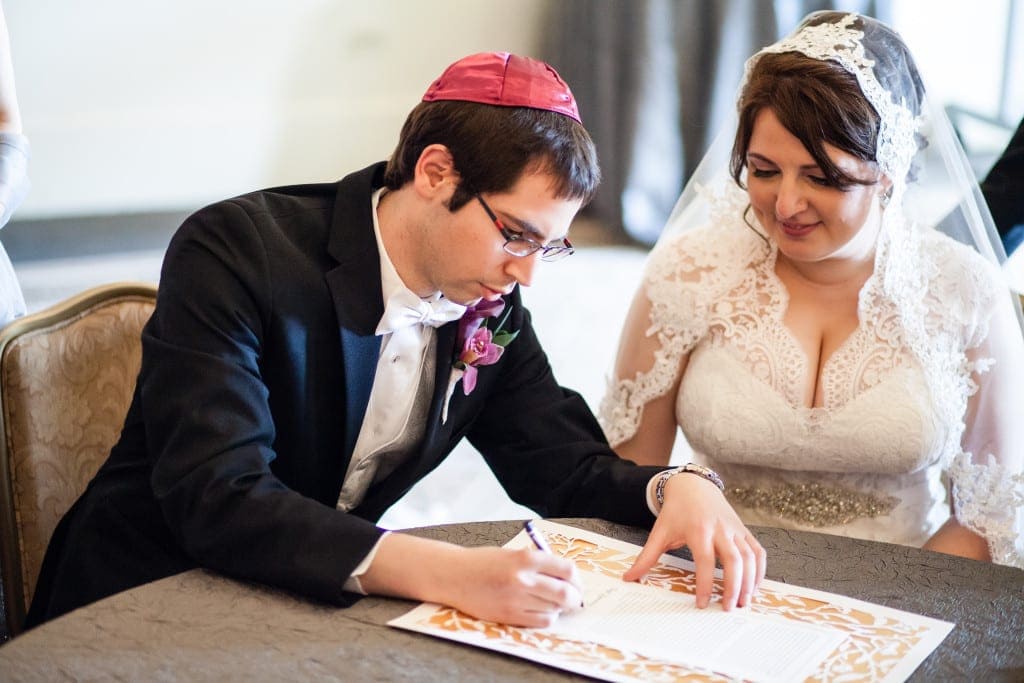 Signing the ketubah.