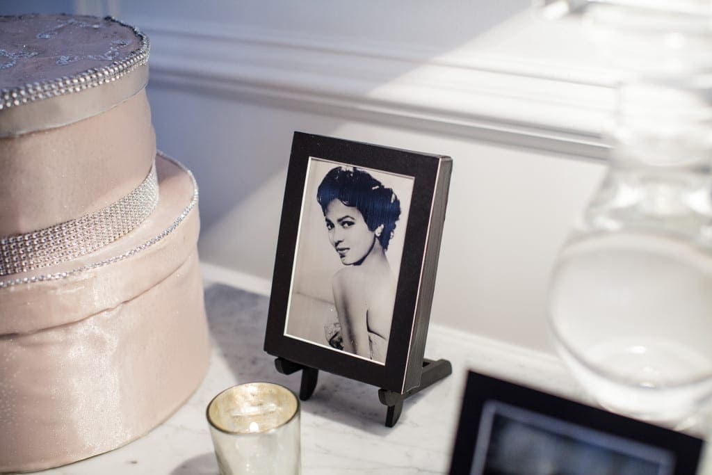 To celebrate African American heritage, this couple had pictures of important and influential figureheads from the past in key places near the cake, on the gift table and on table number displays. 