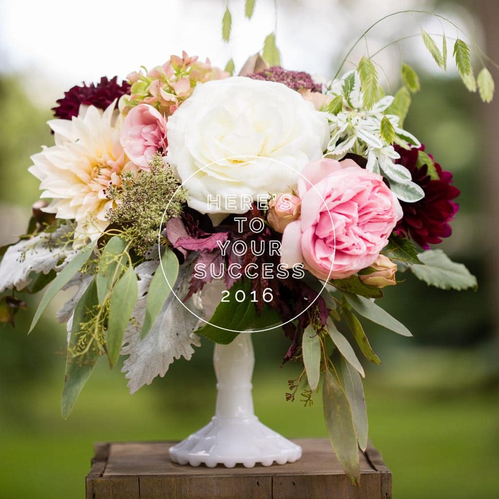 Deep burgundy, pink, and white textured bouquet in a white vase.