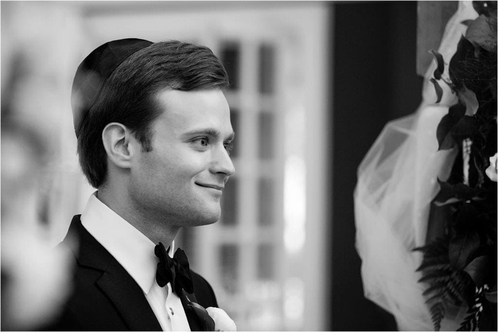 groom reaction during wedding ceremony photo is in black and white- venue is Germantown Cricket Club