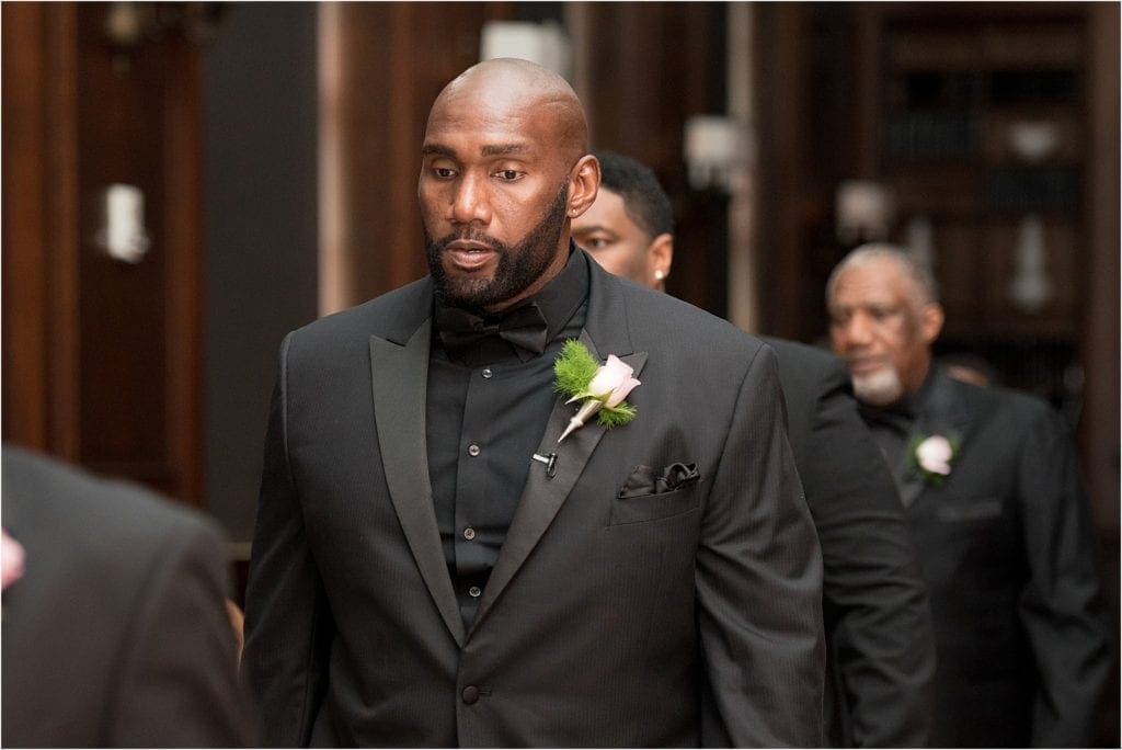 handsome groom walking into chic modern wedding ceremony at Le Meridian