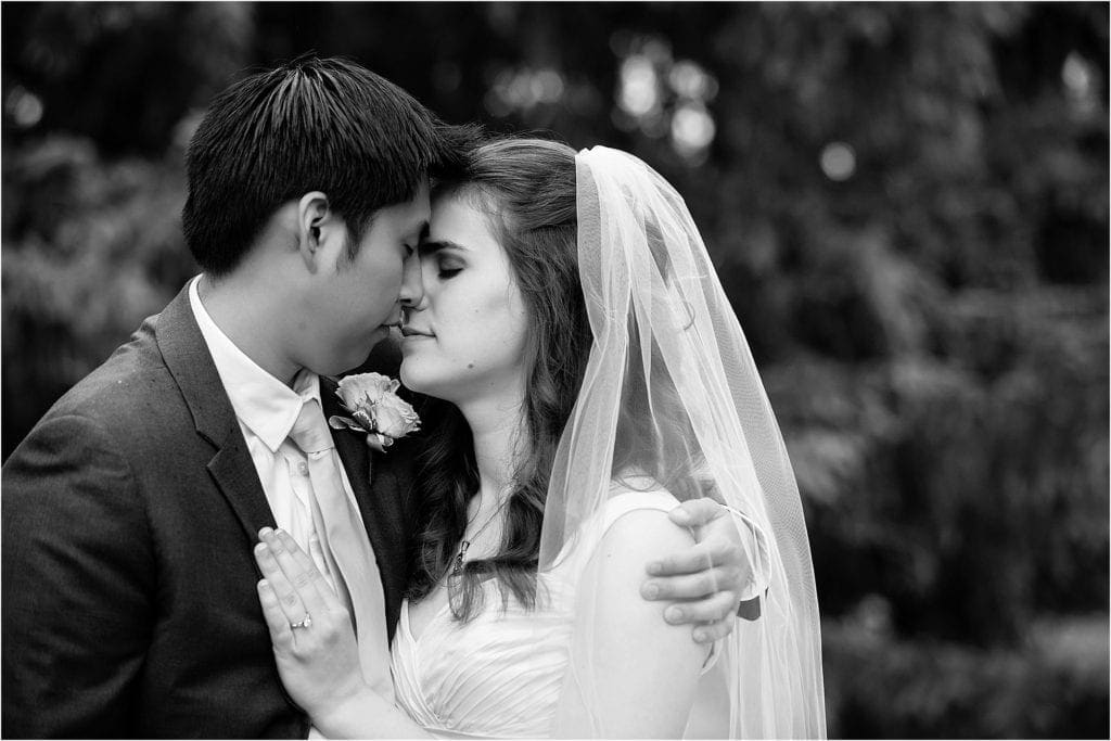 unique portrait ideas of bride and groom, love this pose of couple on their wedding day, photo in black and white