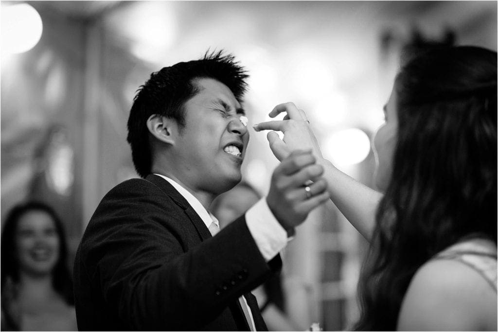 getting messy with cake during wedding 