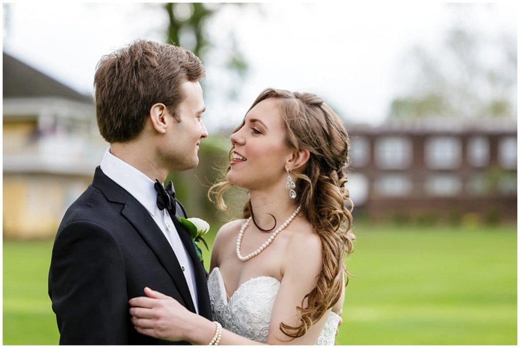 photos of bride and groom during first look at GERMANTOWN CRICKET CLUB