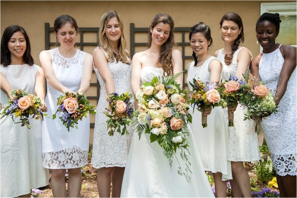 Unique idea for bridesmaids for DIY rustic wedding, why not wear white and add some pretty flowers