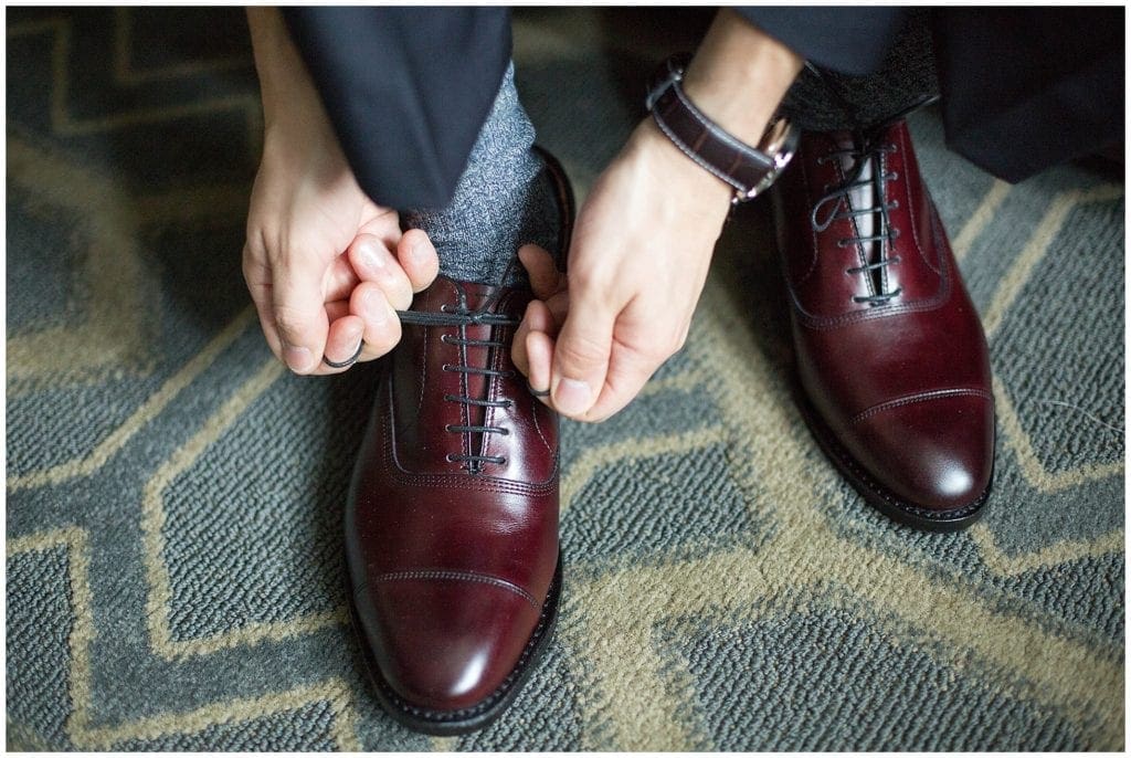 Shoes also matter to the guys. Groom getting ready photos