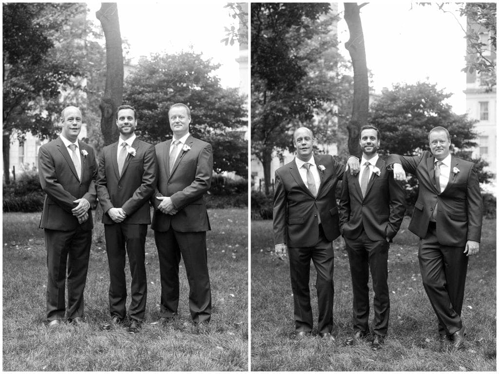 Black and white grooms mens photos outdoors in Philly
