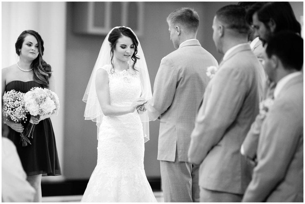 Black and white photo of vowels during wedding ceremony Blessed Theresa of Calcutta Church