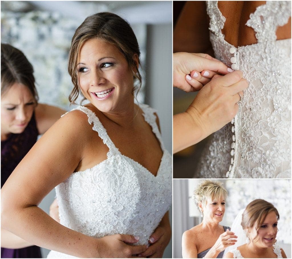 bride getting ready in lace gown 