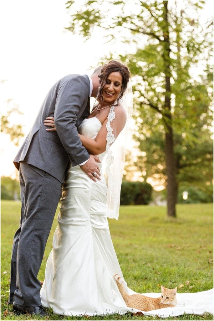 Fun photo of bride and groom and a CAT