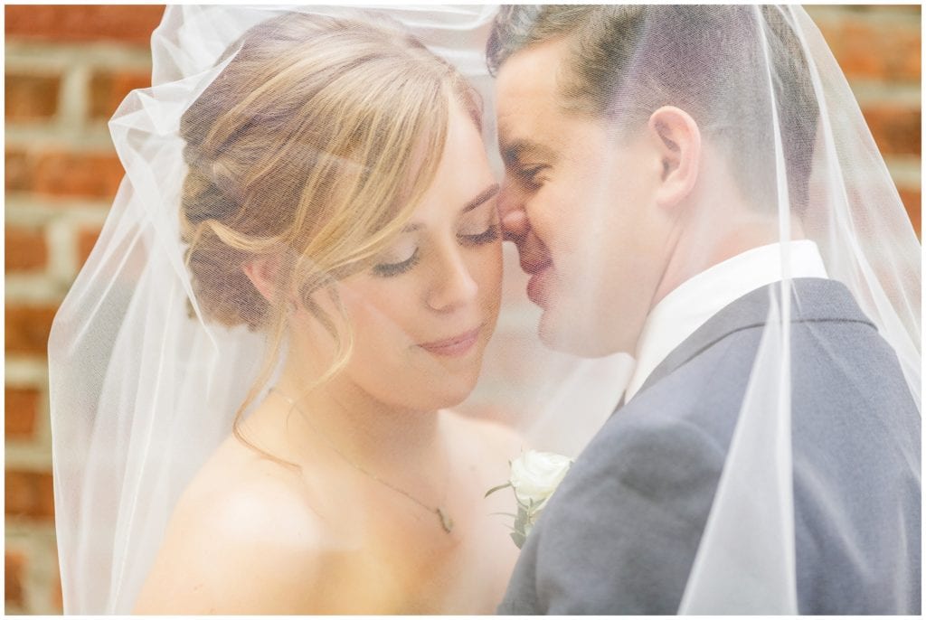  Jessica and Andy posed for this intimate portrait under her veil at Rittenhouse Square