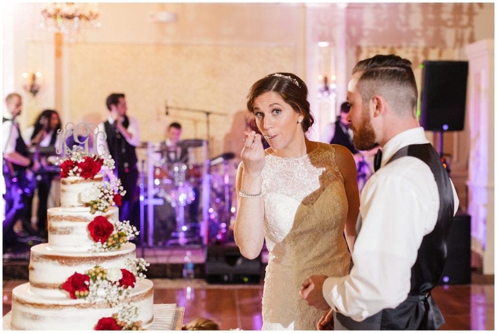 Fun bridal pose while tasting her Palermo naked cake- The Farmhouse at the Grand Colonial wedding 