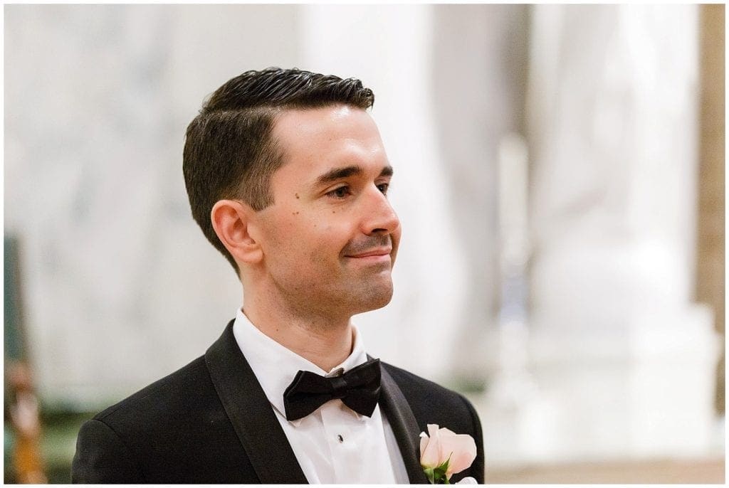 Groom seeing his bride for first time walking down St. Patrick's Church