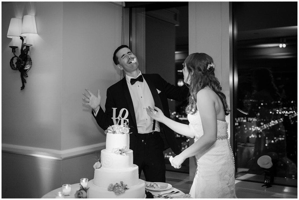 Fun cake cutting smash during wedding in Philadelphia 
