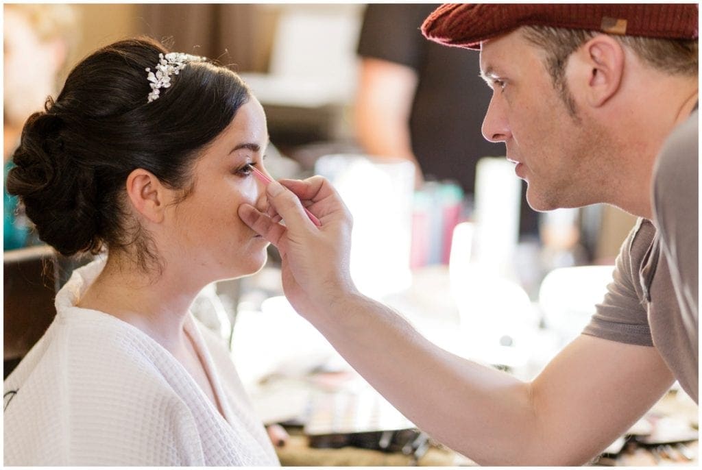 bride getting her makeup on- unique hair bridal accessory 