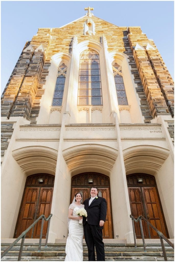 Bride & Groom on stairs of St Coleman's Church in Ardmore- wedding ceremony in PA 