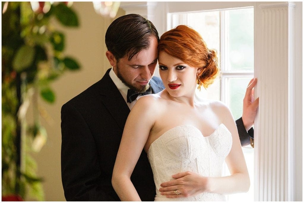 romantic pose of bride and groom at Bolingbroke Mansion