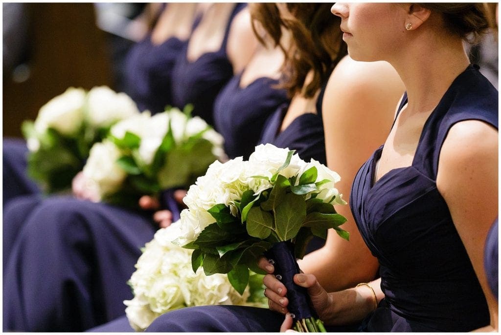navy bridesmaid dresses and white bouquets make a great wedding color combo