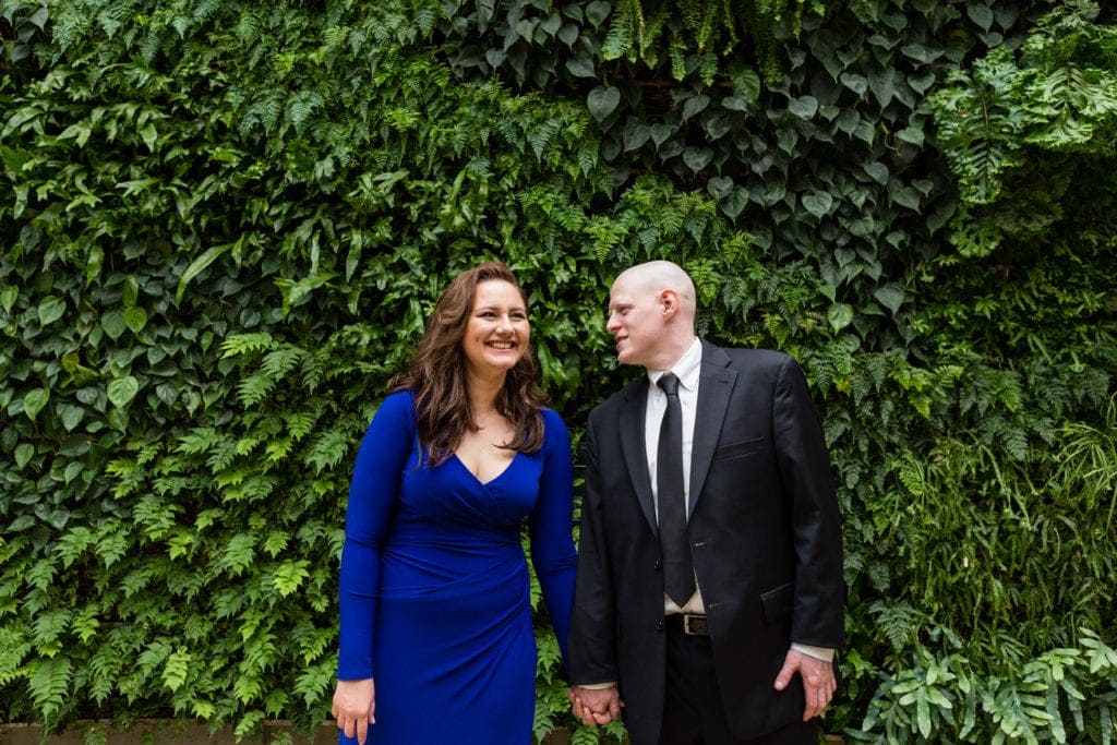 Engagement Session in from of Longwood Garden's Greenery walls near the most beautiful public restrooms in America