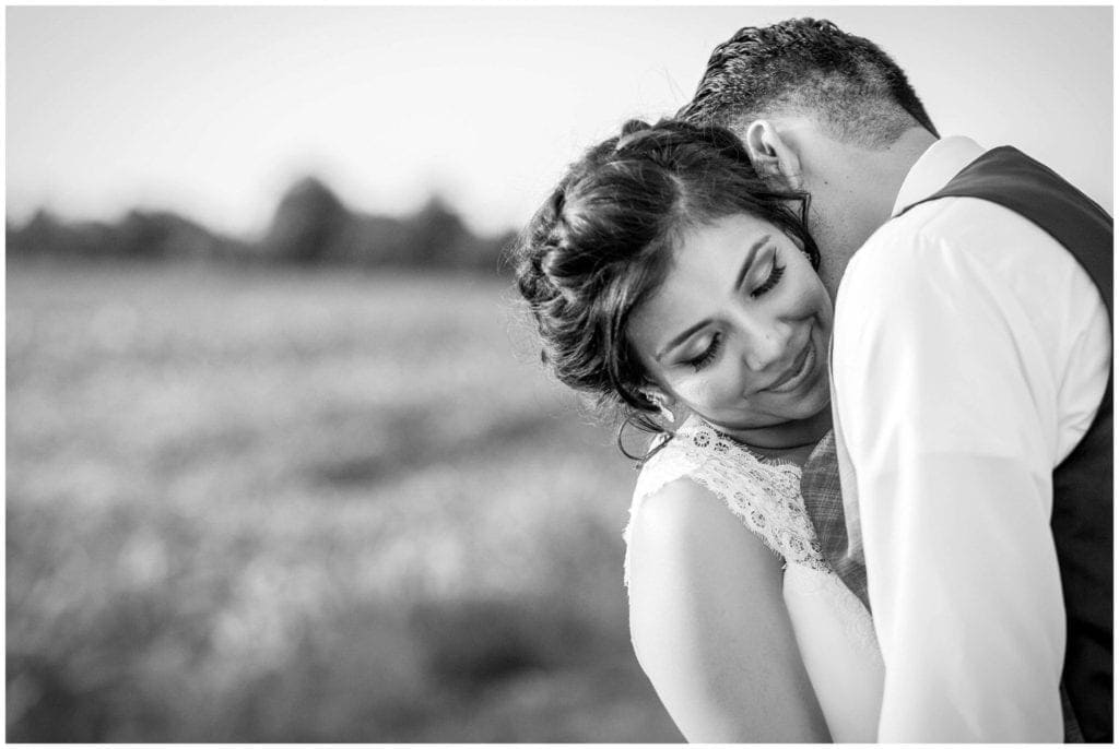 Black & White Portrait of a Bride & Groom embracing at their Historic Penn Farm Wedding 