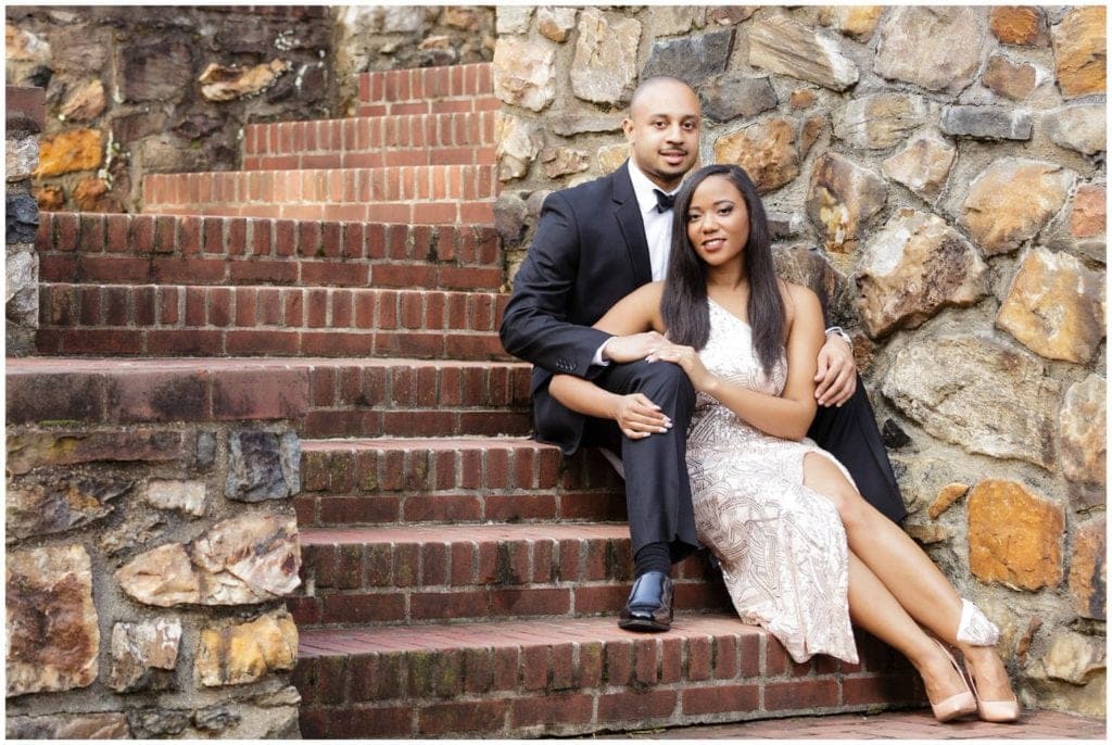 The juxtaposition of Alexandra & Joey's formal attire with the rustic elements of the brick and stone staircase adds interest to the images from their Longwood Gardens engagement session.