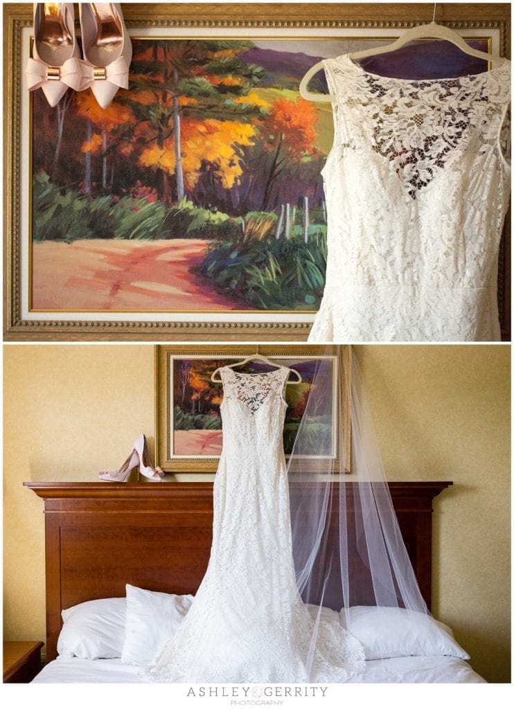 Wedding dress & shoes hanging from artwork at the Radnor Hotel During Bridal Prep