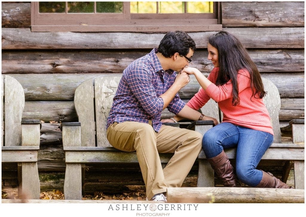 Groom Kissing hand during a Morris Arboretum Engagement Session