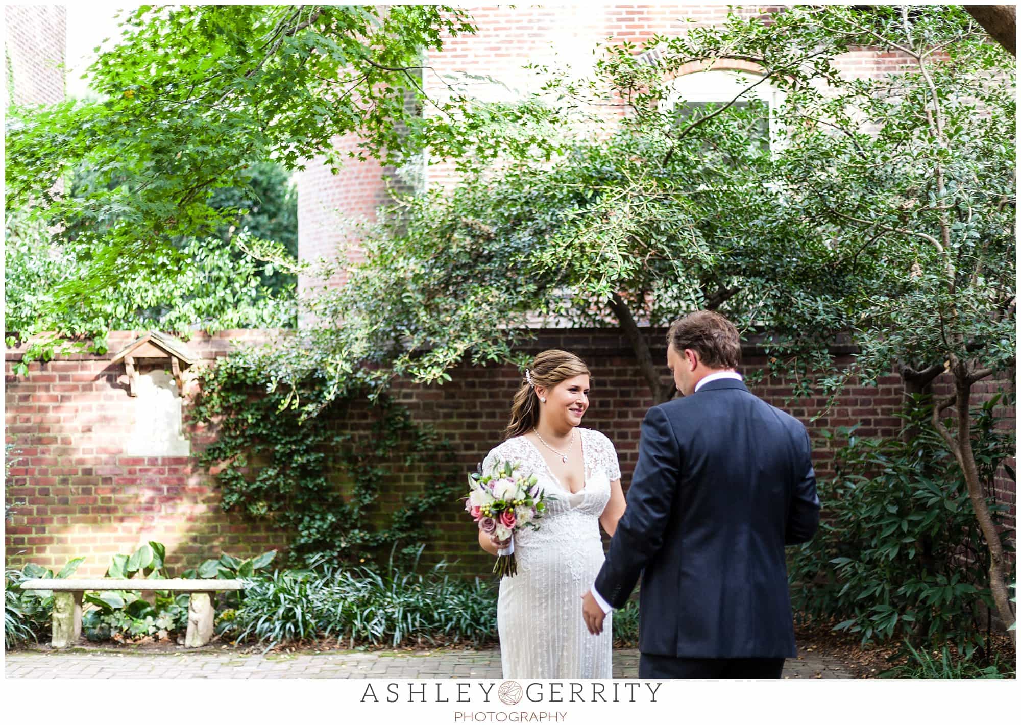 Bride & Groom see each other during their first look in the courtyard at the historic Colonial Dames in Philadelphia, PA