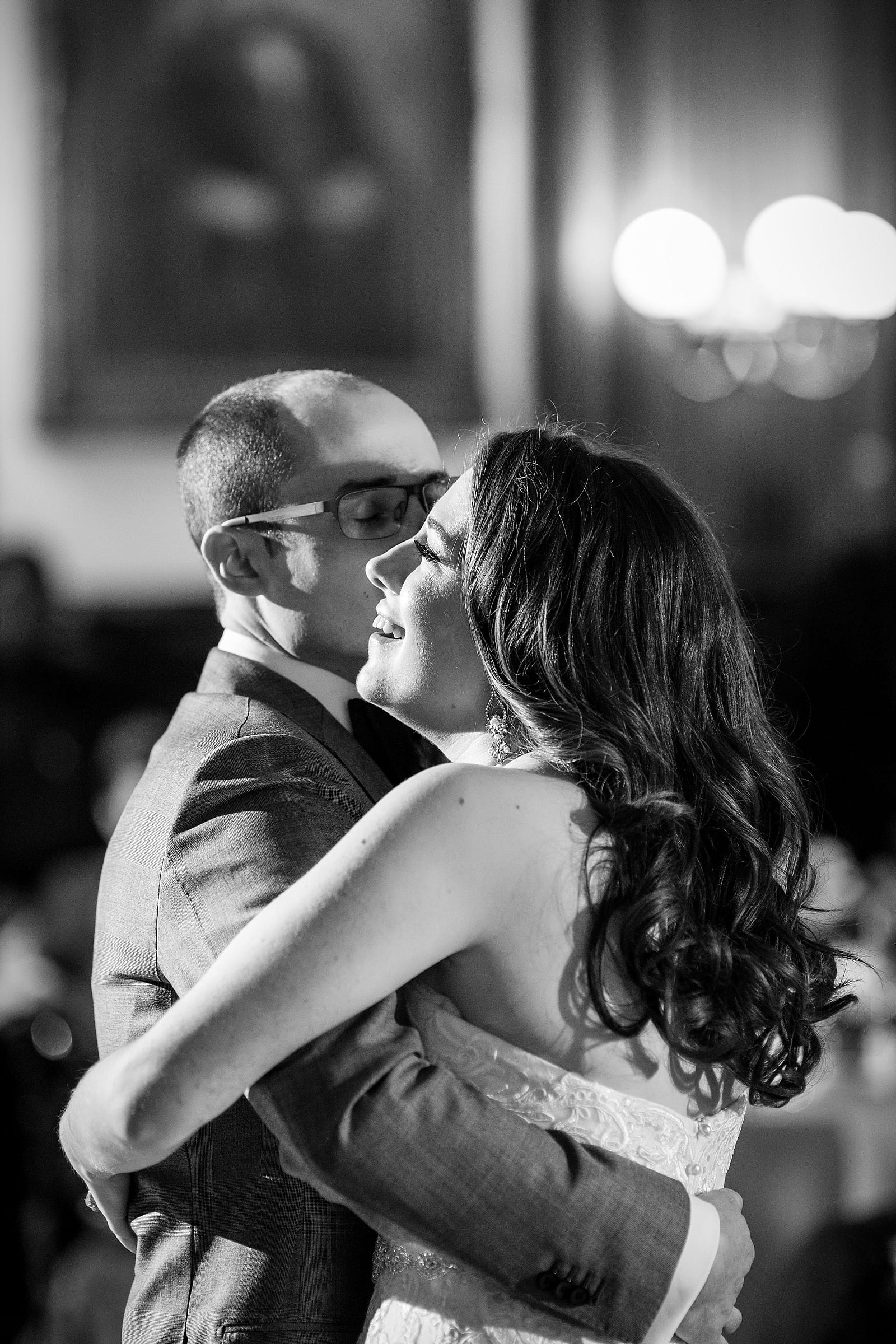 Black and white bride and groom first dance, happy portrait 