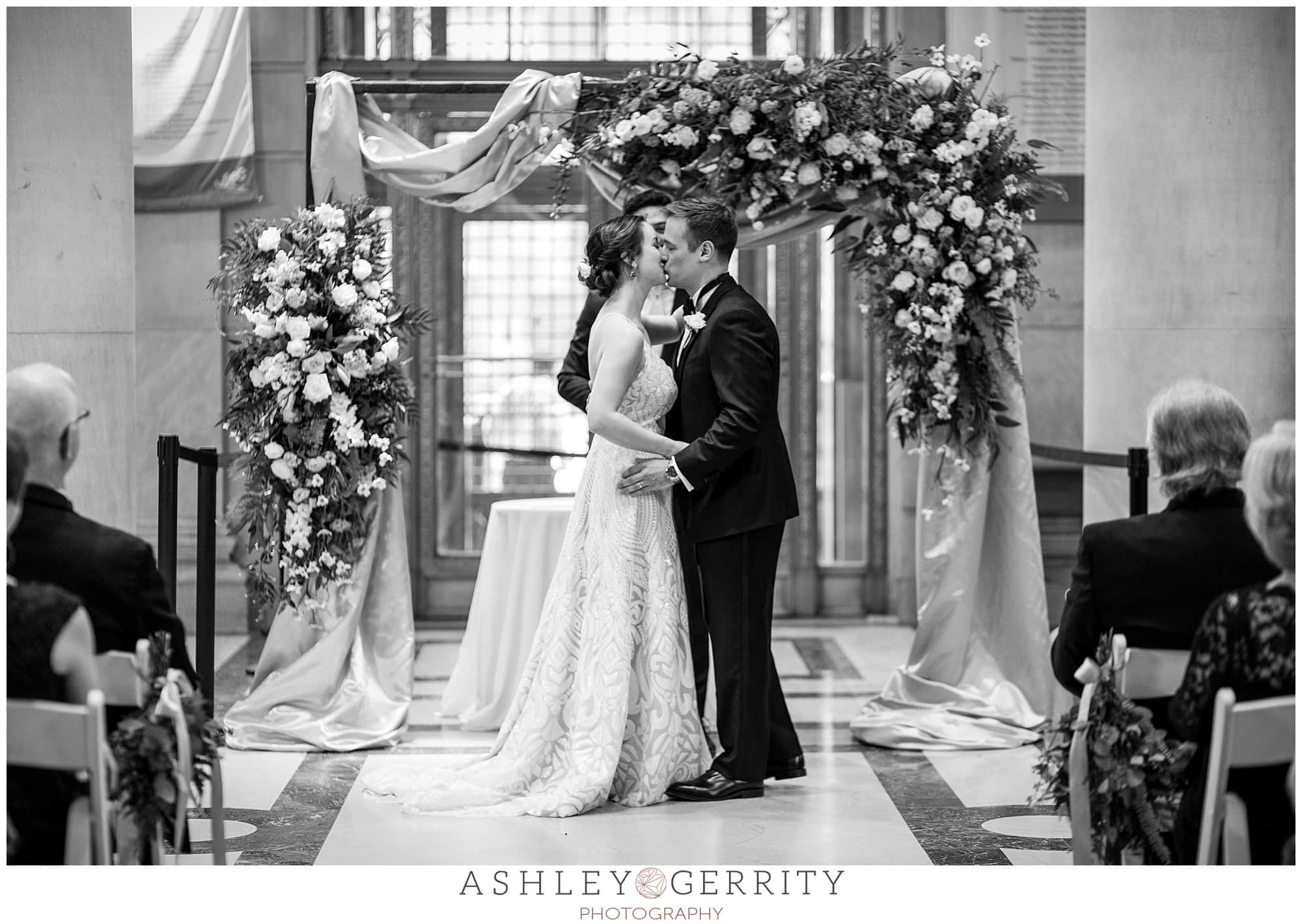 Black and white, first kiss as husband and wife, Free Library wedding