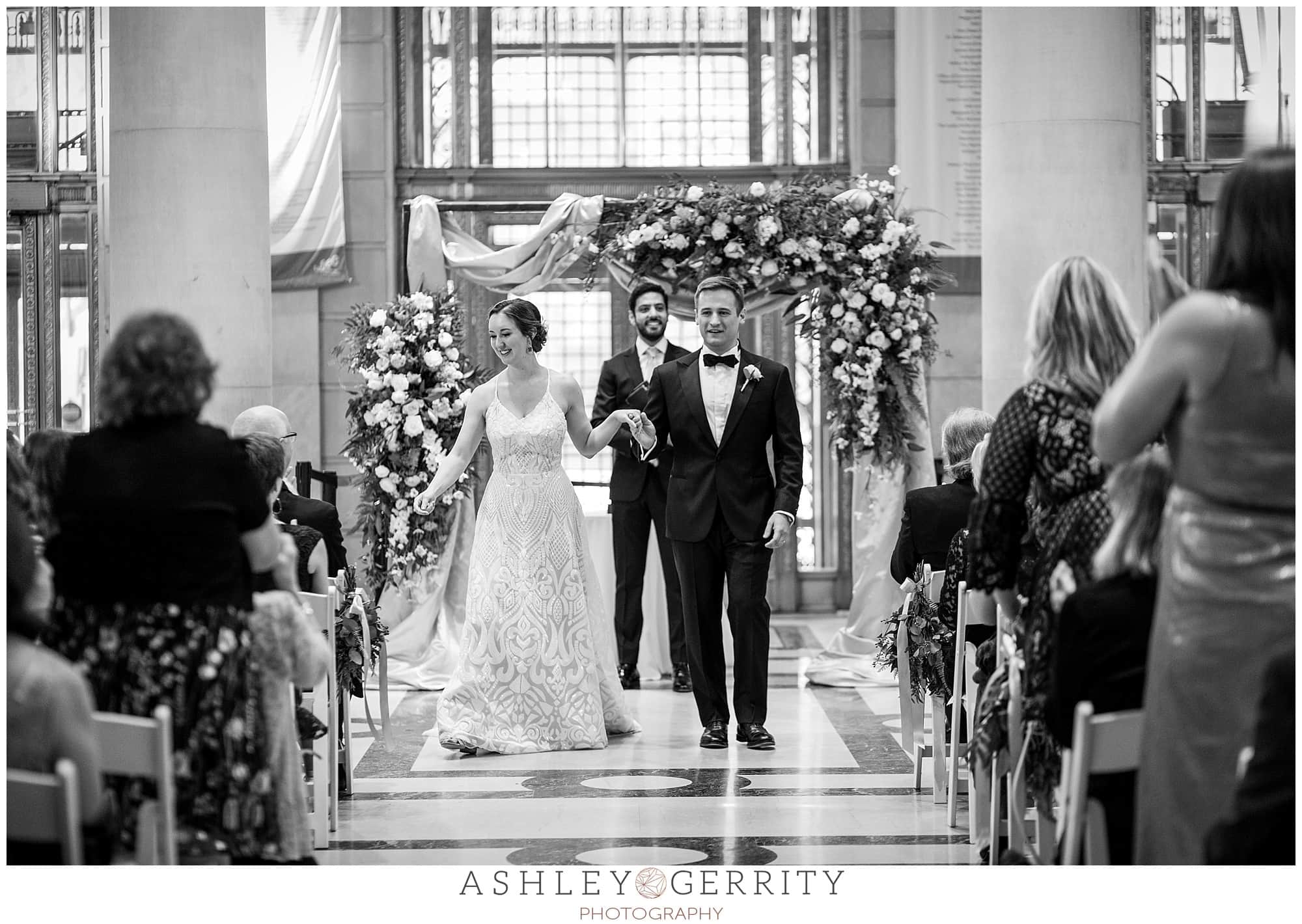 Bride and Groom recessing after ceremony, black and white, Free Library wedding