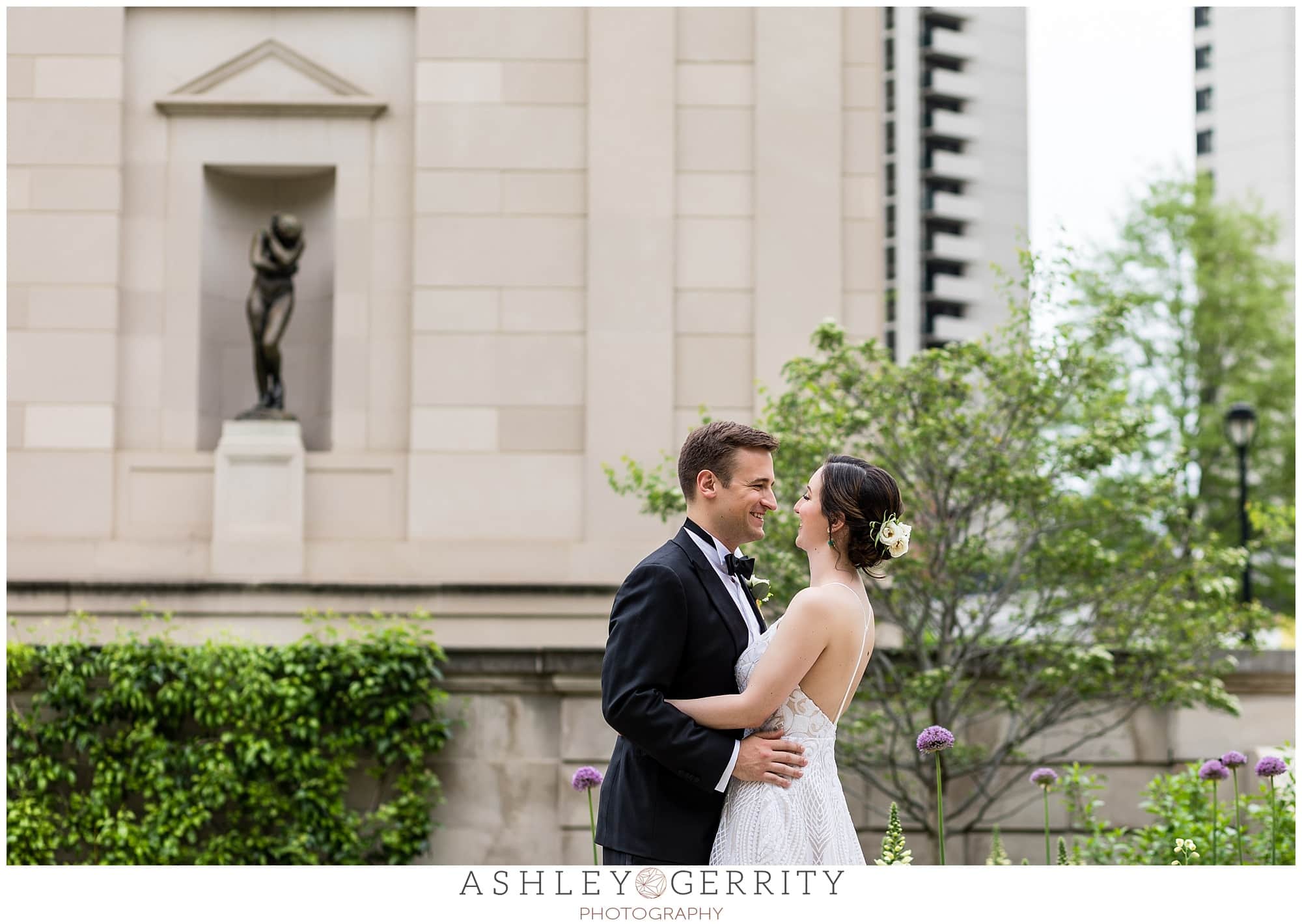 Bride and groom portrait, bride and groom hugging and smiling, Free Library wedding