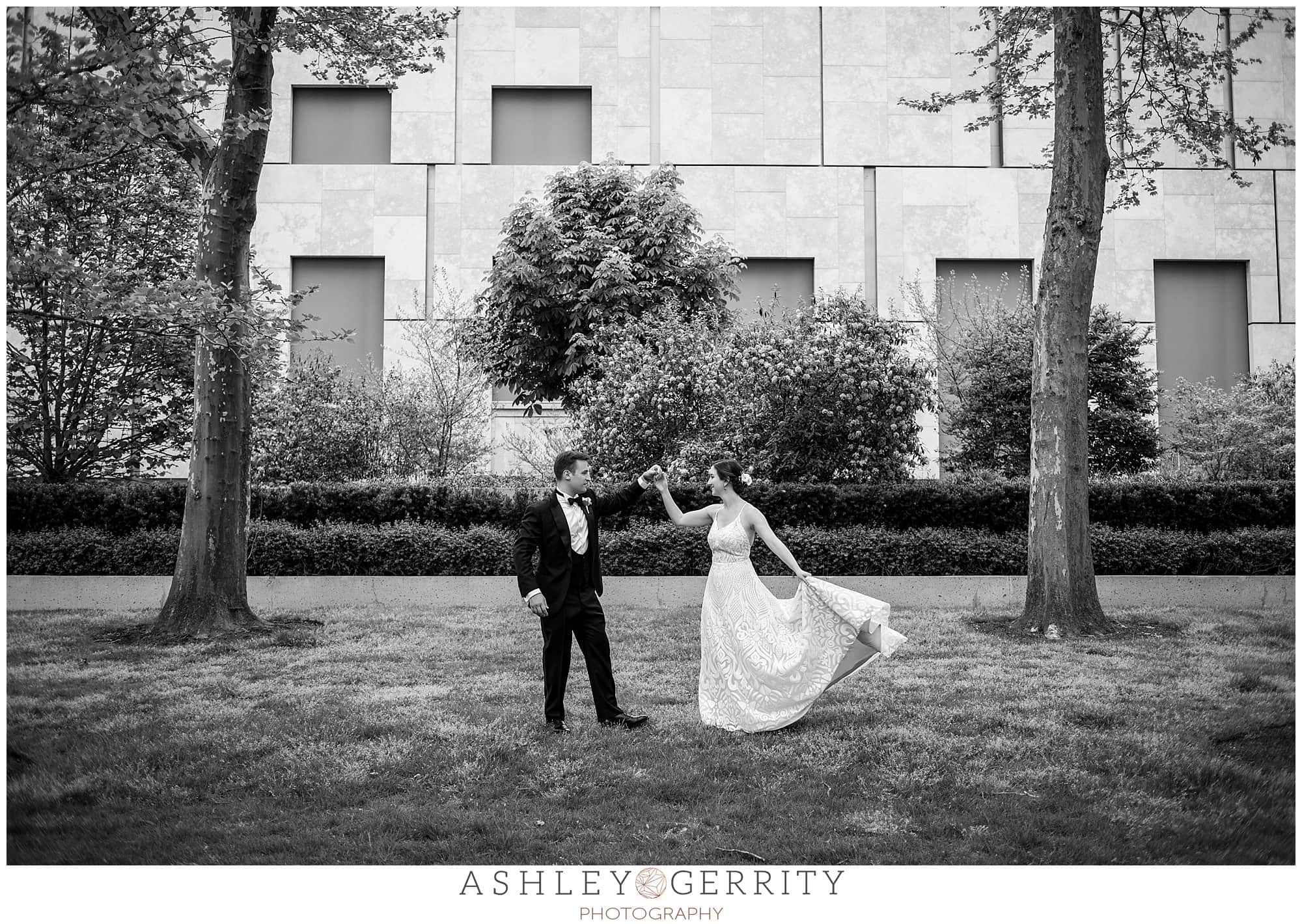 Black and white bride and groom, groom dancing with bride, Free Library wedding