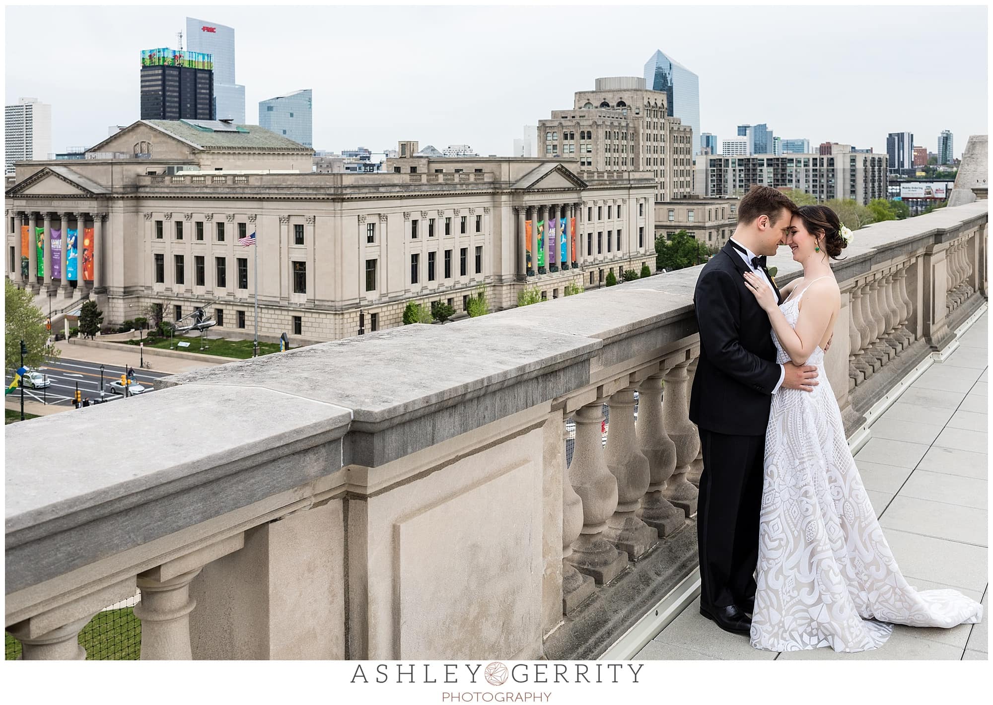 Bride and groom intimate portrait looking at each other from the roof of the Free Library, Philadelphia wedding